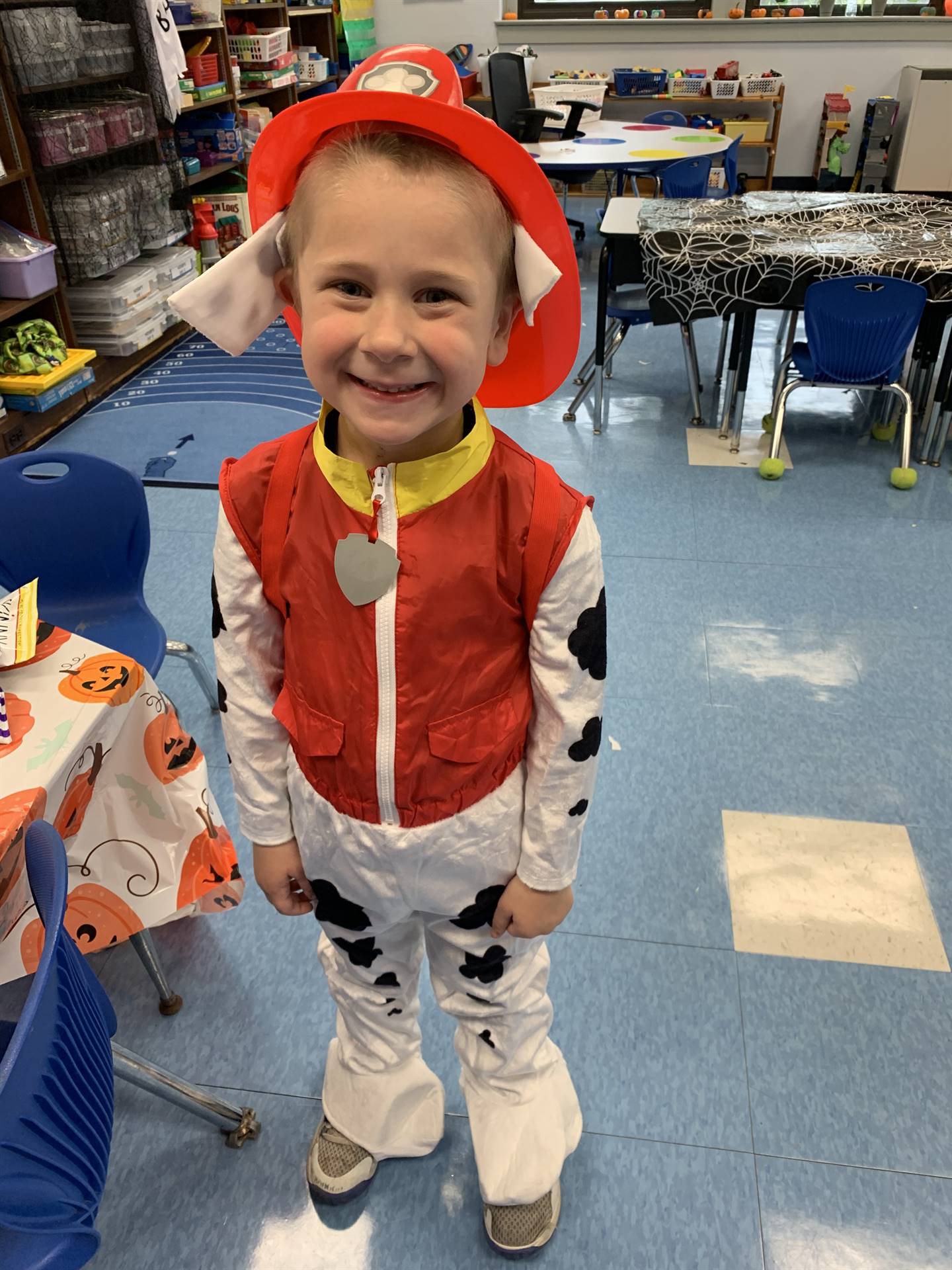 a student dressed as sparky the fire dog