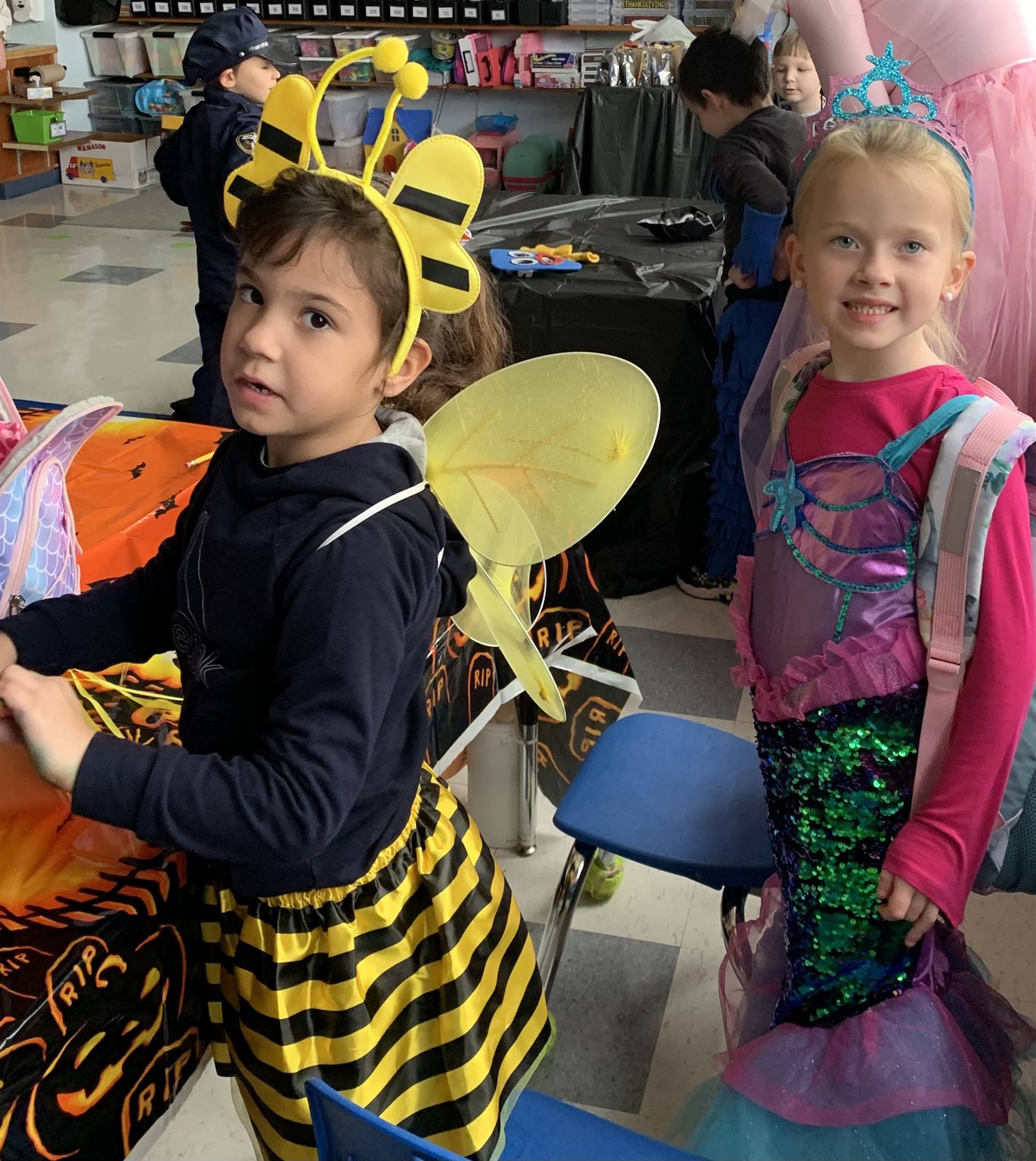 a student dressed as a bumble bee and another a mermaid