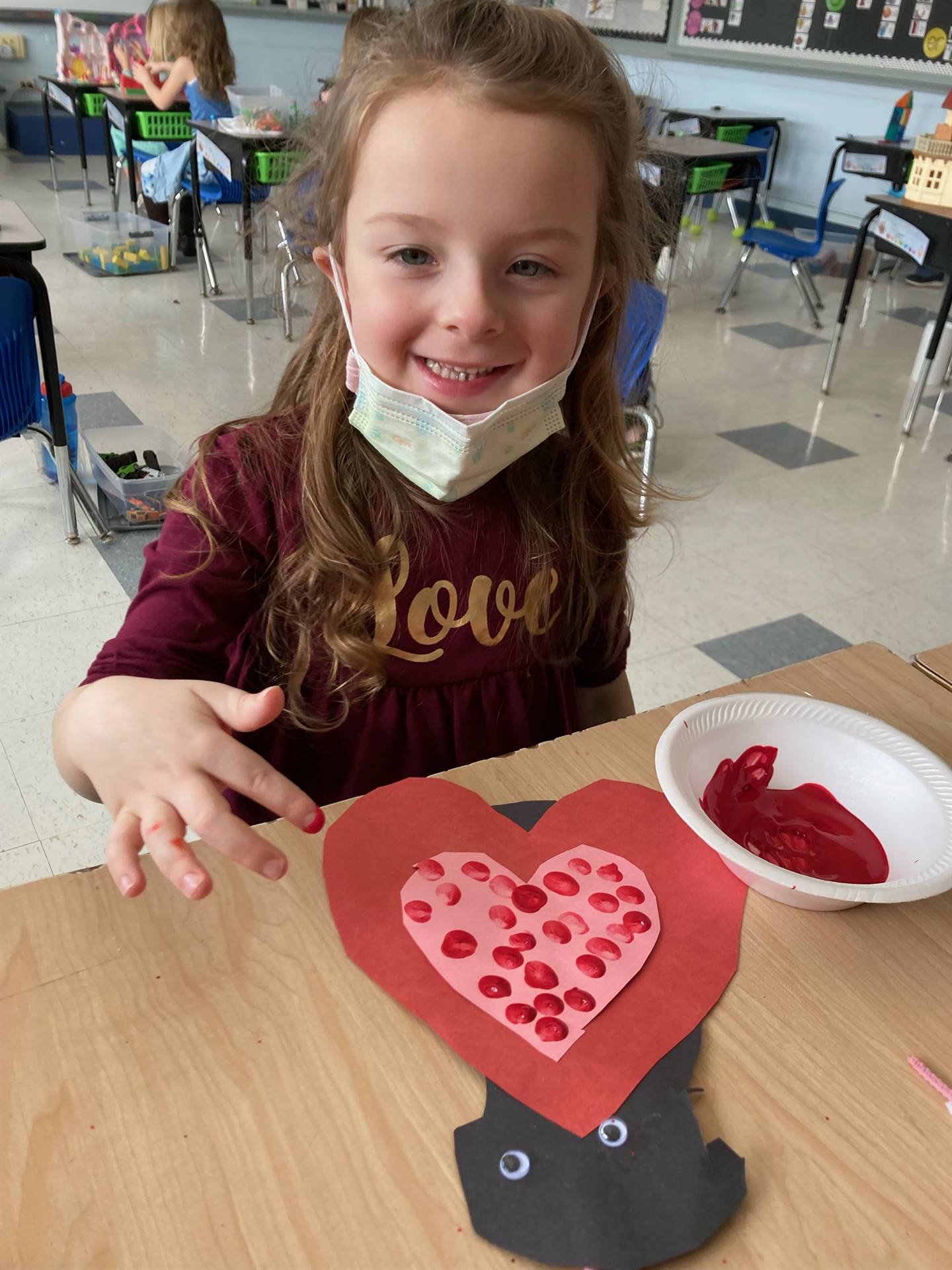 student with a heart craft
