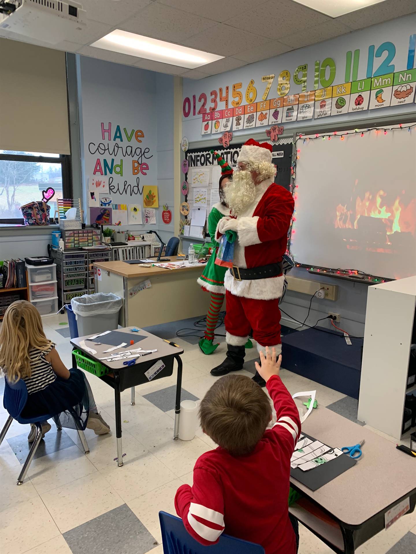 Santa talks with group of students.