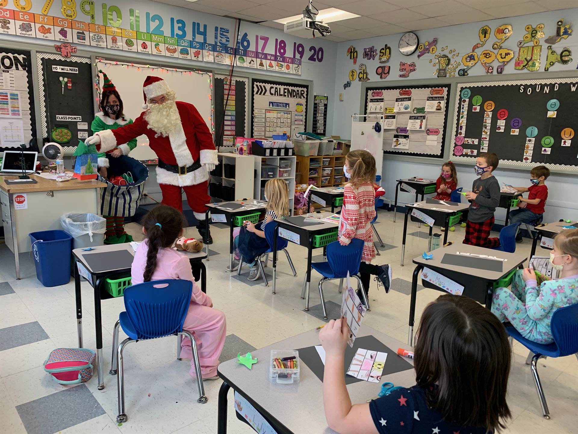 Santa talks with group of students.