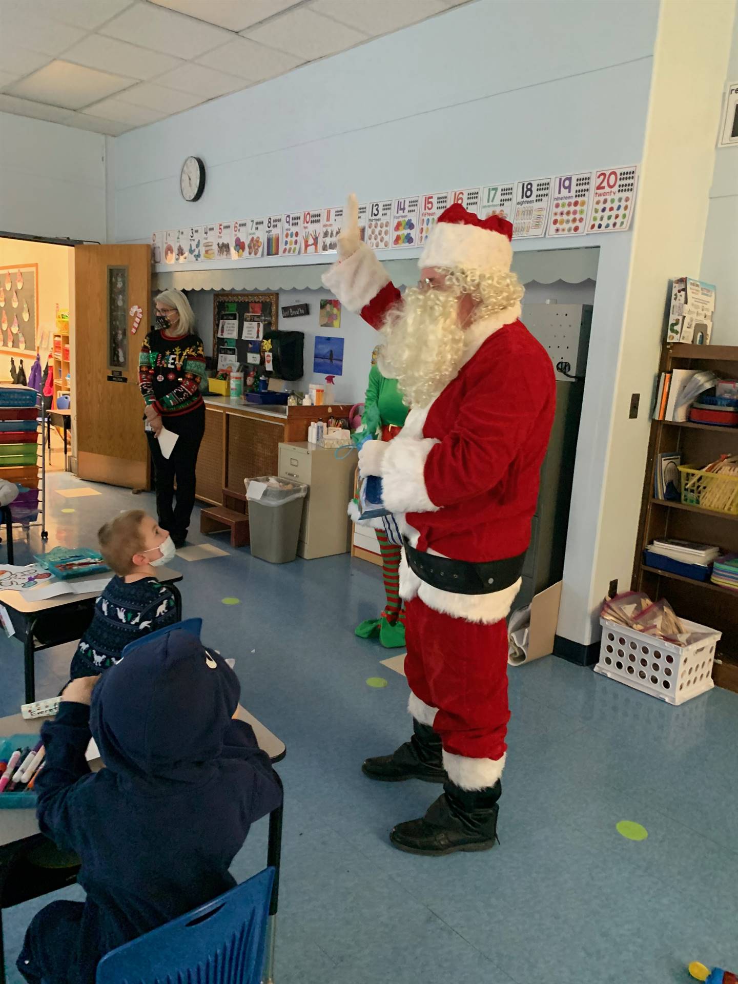 A student asks Santa a question. 