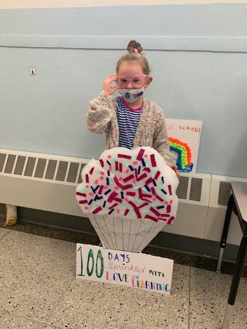 student dressed up as 100 years old holding an Ice cream cone saying 100days sprinkled with love.