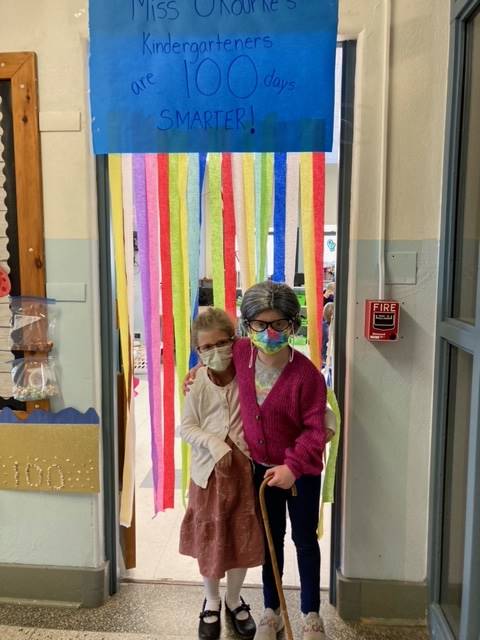2 students dressed up as 100 years old with cane.