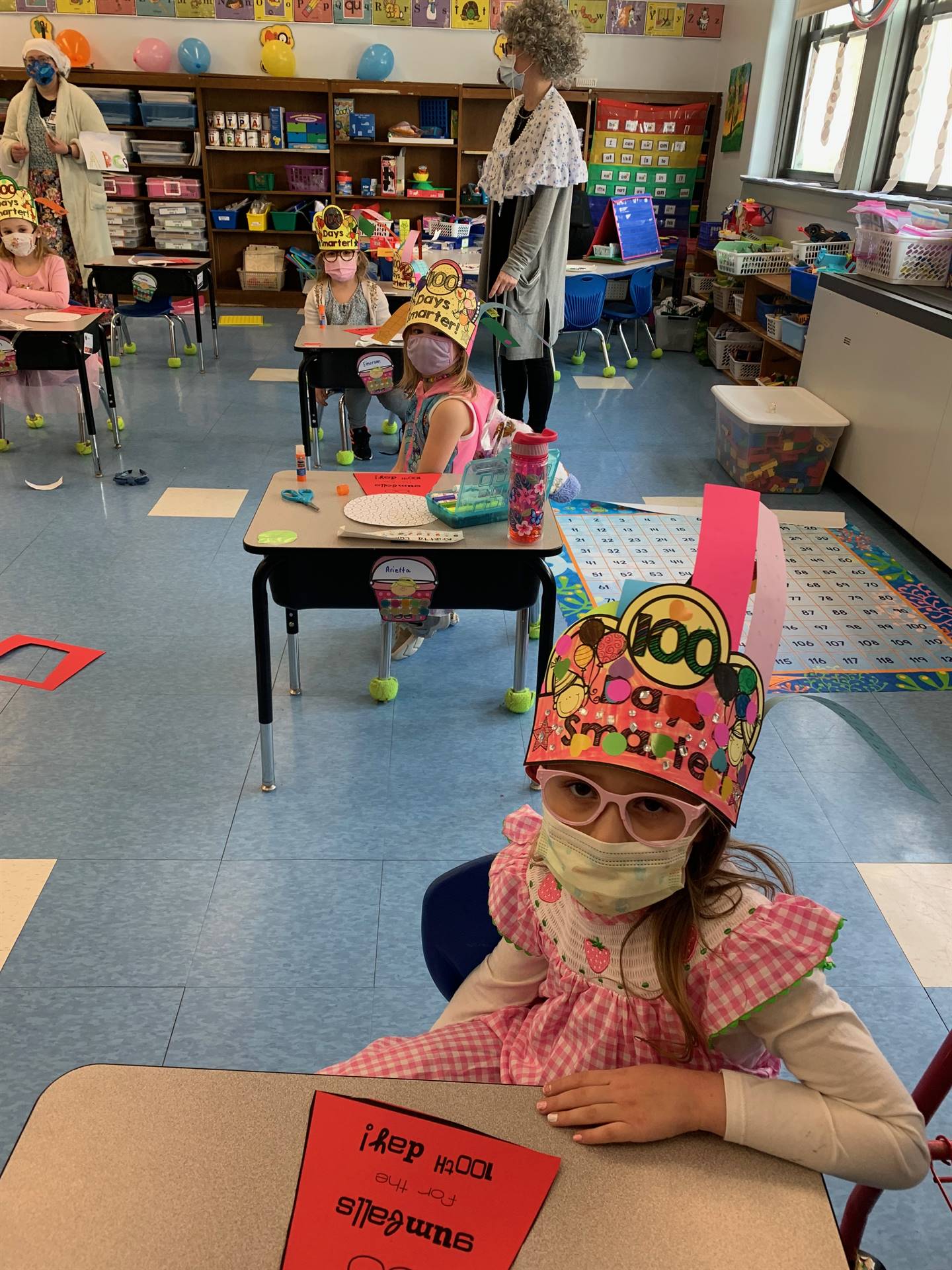 student with 100th day celebration hat