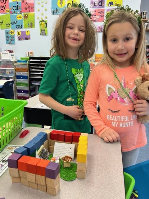 2 students with a multicolored block structure