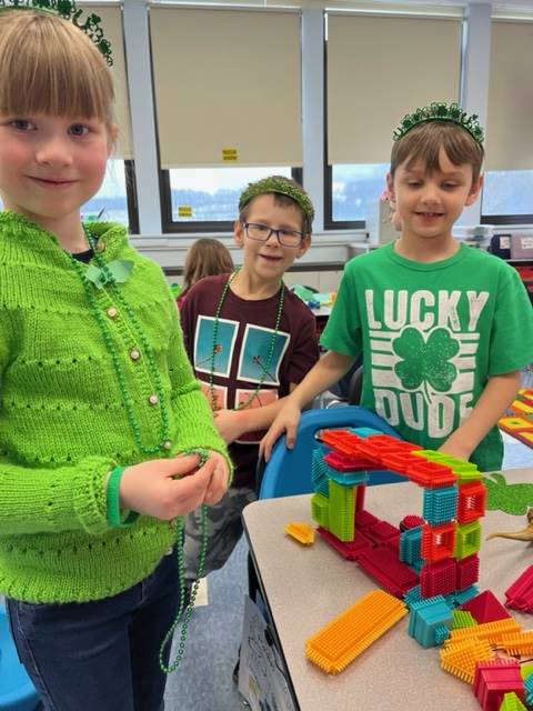 3 student with a multicolored block structure