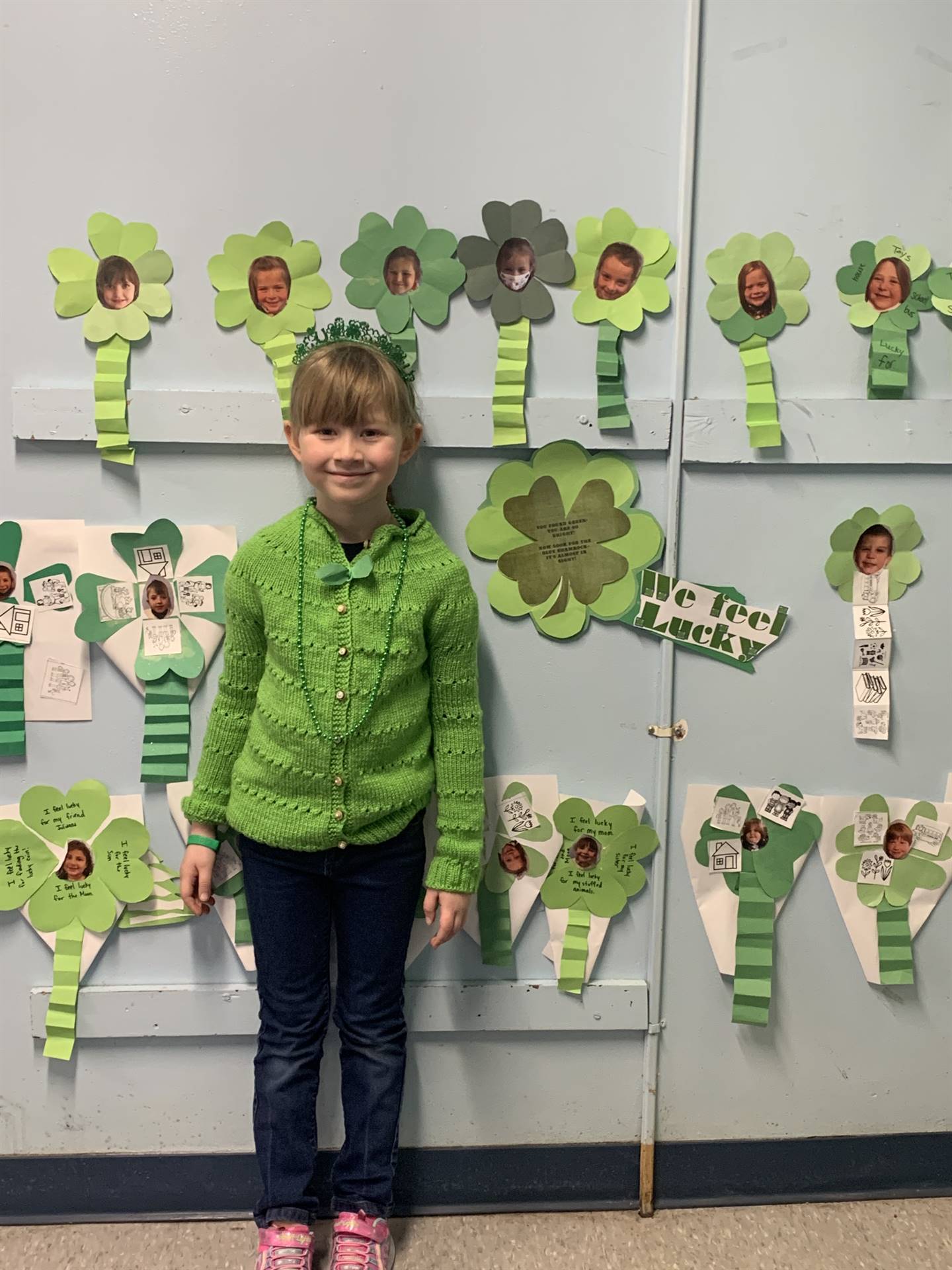 a student with a field of shamrocks in background