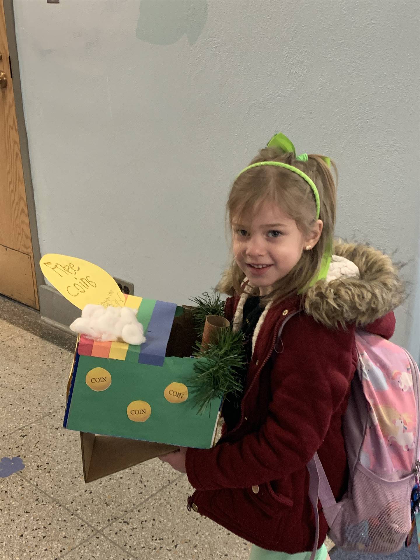 student carrying in a leprechaun trap