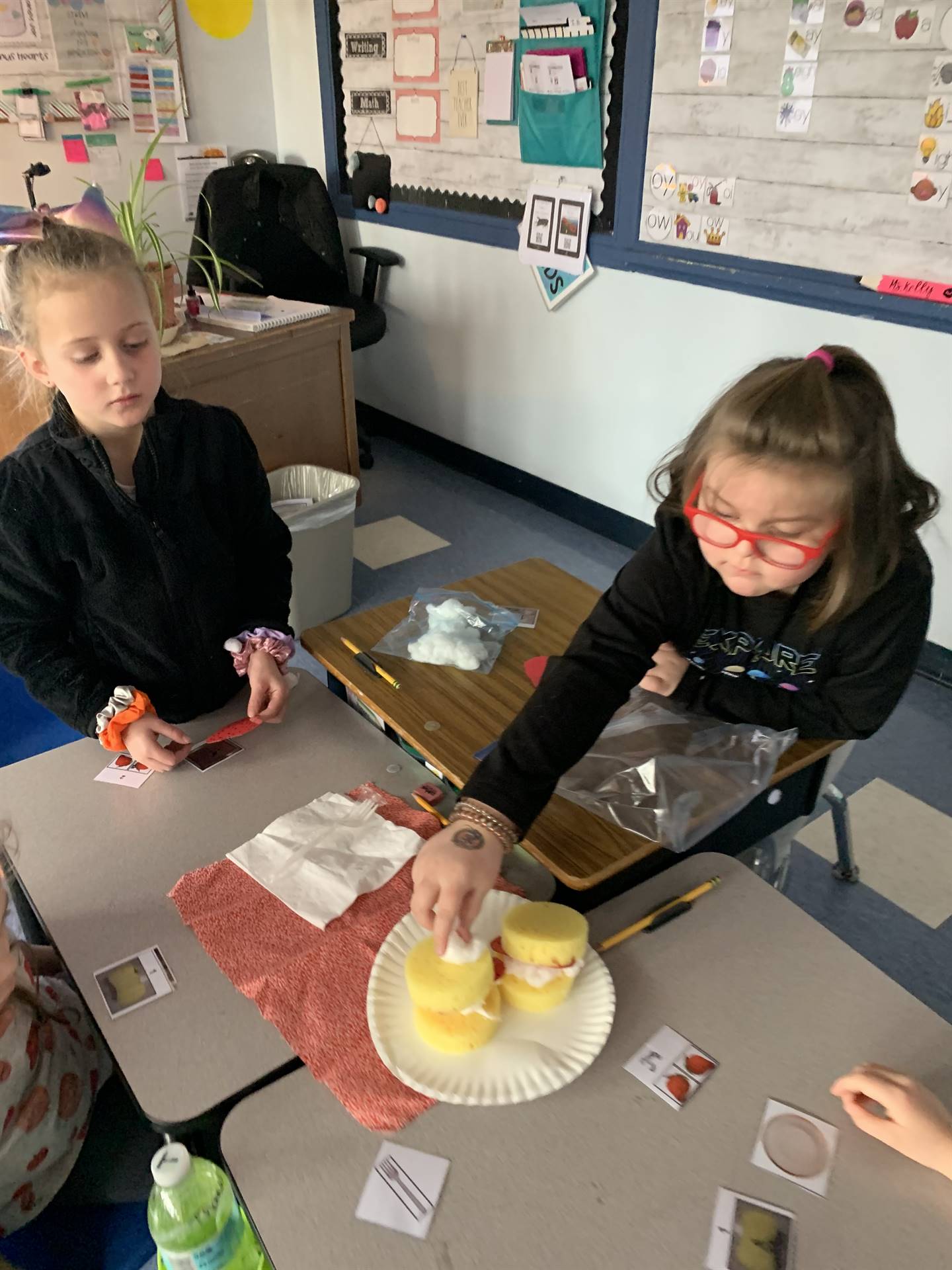 students working together to build a shortcake