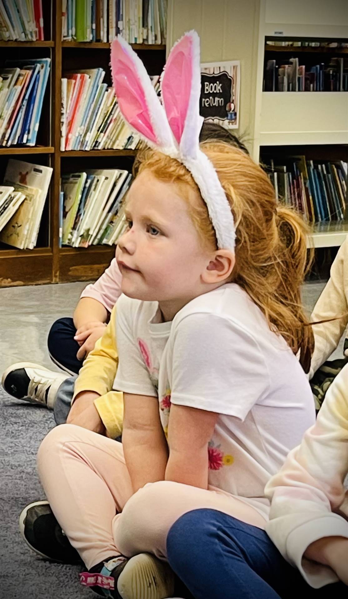 a student with pink bunny ears.
