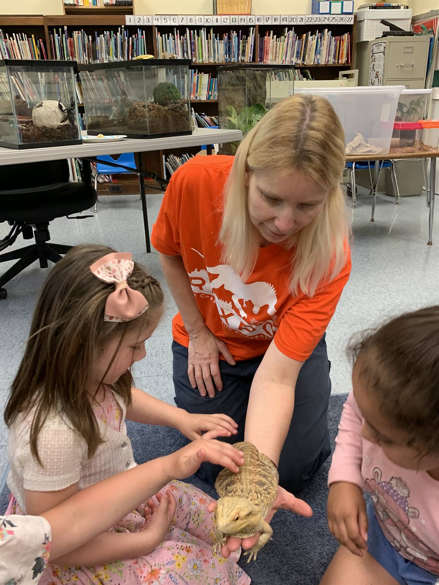Miss Sonya holds reptile for students