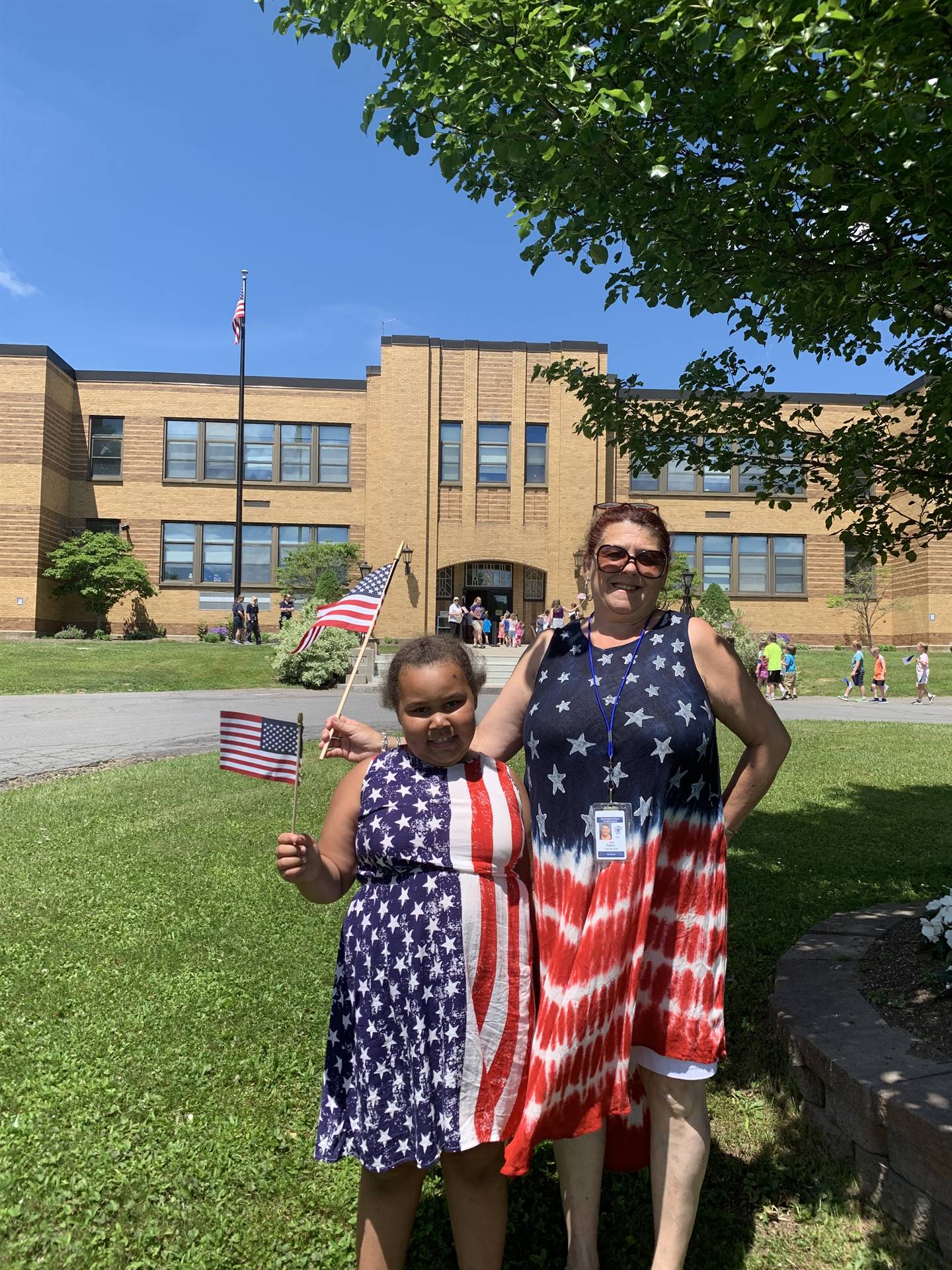 a mother and daughter in red white and blue for flag day