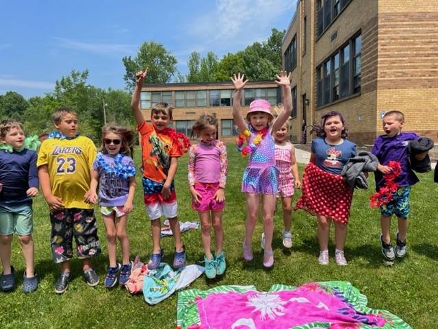 a group of students dressed in beach attire outdoors