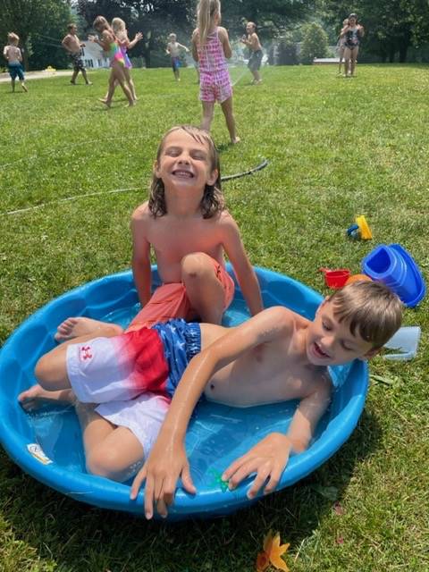 2 students in wading pool