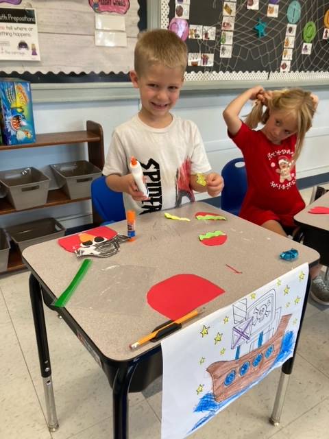 2 students working on their pirate crafts
