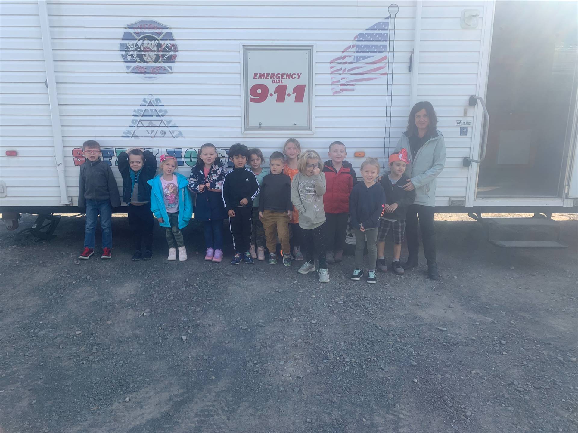 students standing outside of 911 house