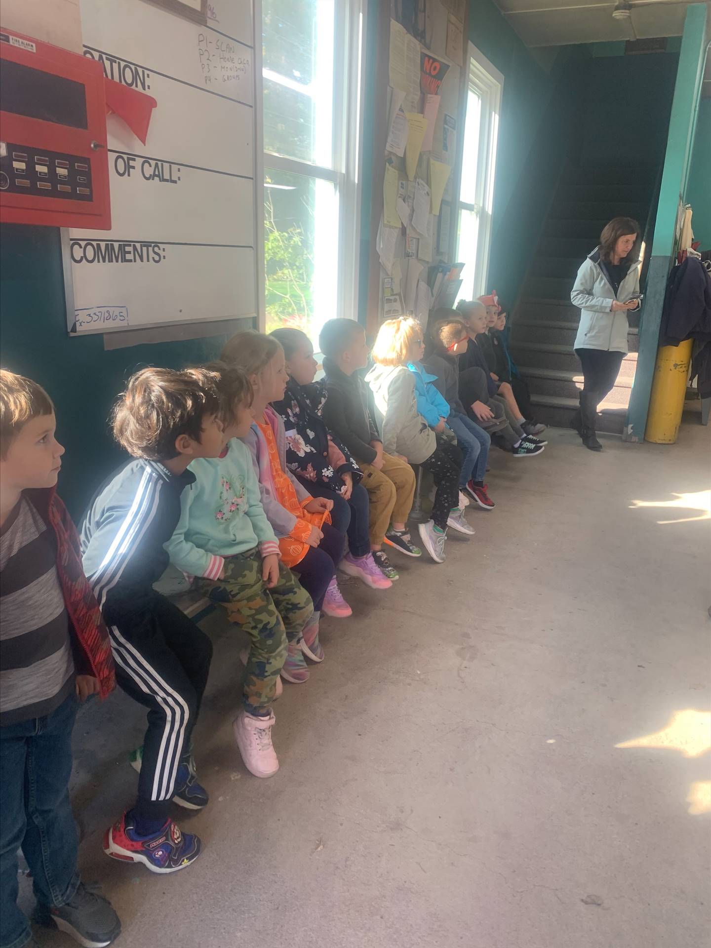 students sitting on a bench 