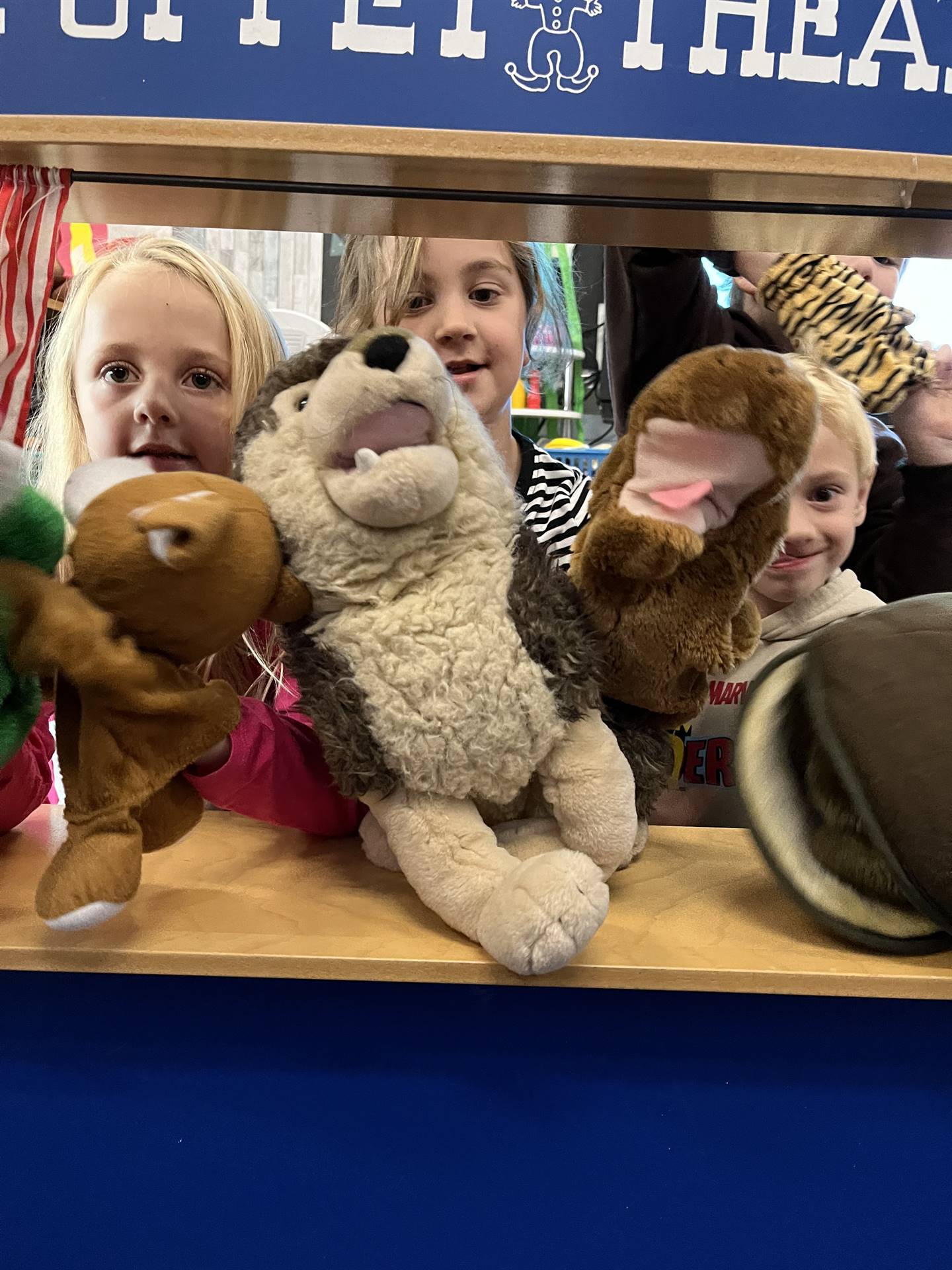 students and puppets in cooperative play