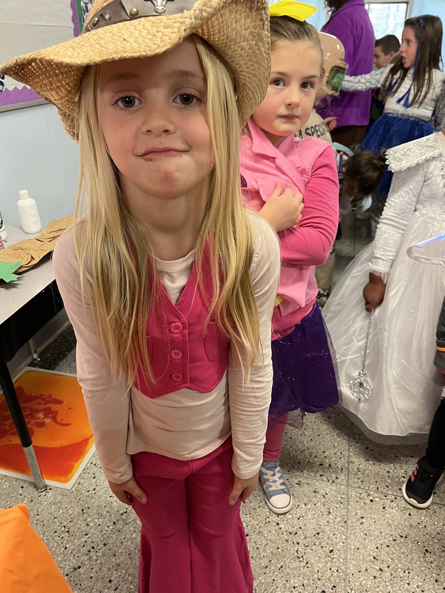 a student dressed in cowgirl style with hat.