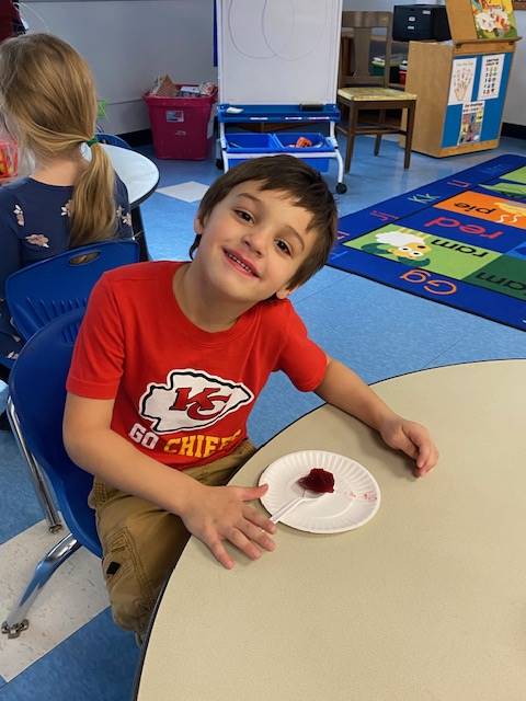a student tries cranberry sauce