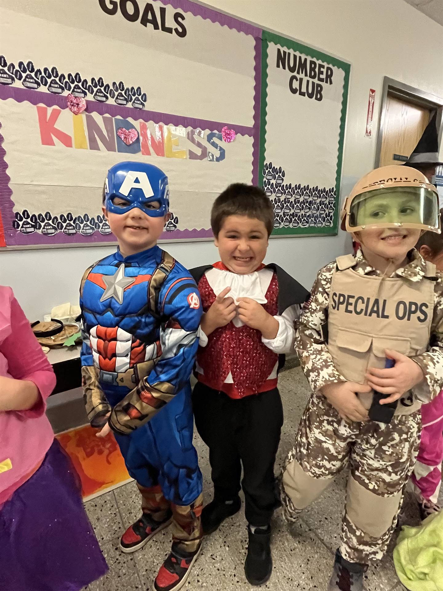 group of 3 students dressed up for Halloween