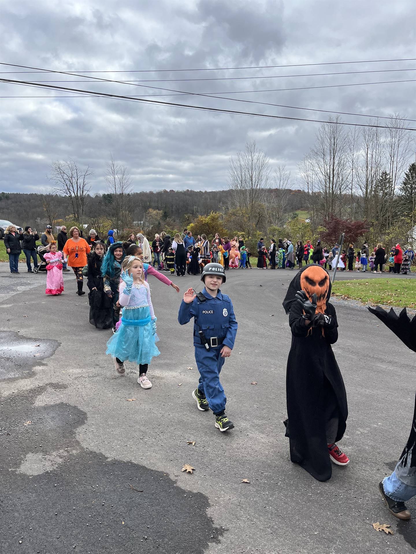 group of students dressed up for Halloween and parading.