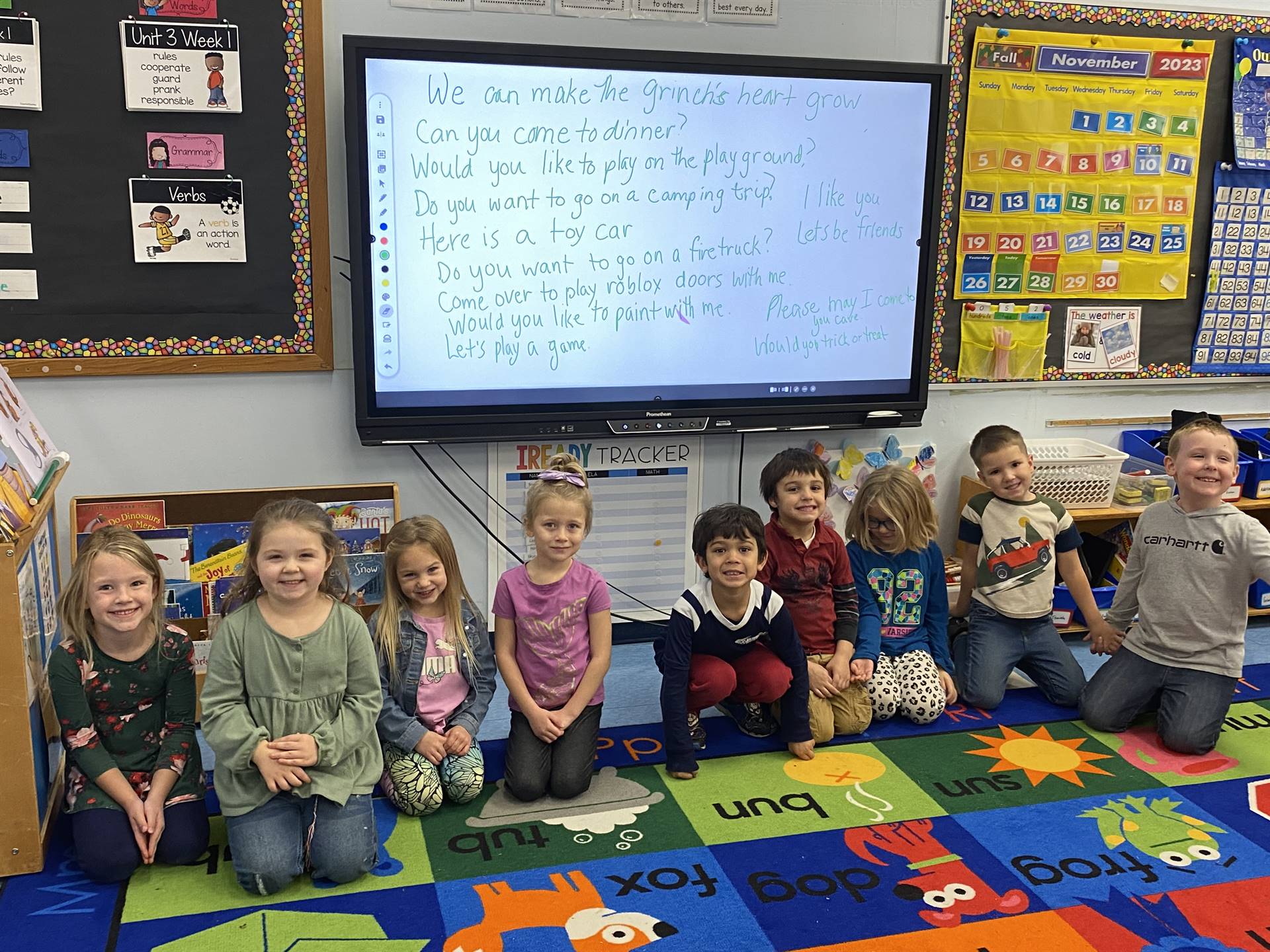 Students sit in front of whiteboard with sentences of things they would say or do to make the Grinch