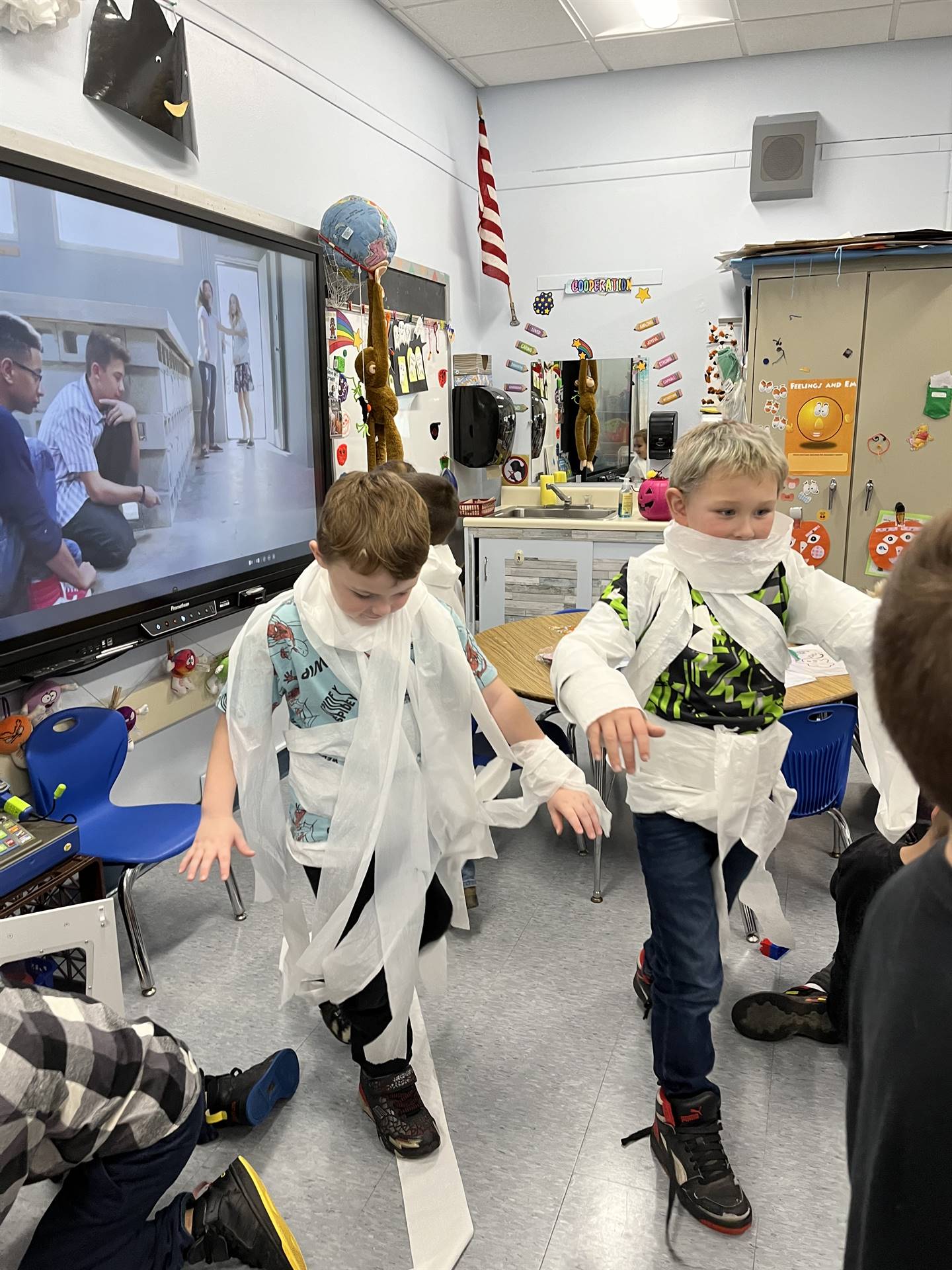 kid Mummies walking into a classroom