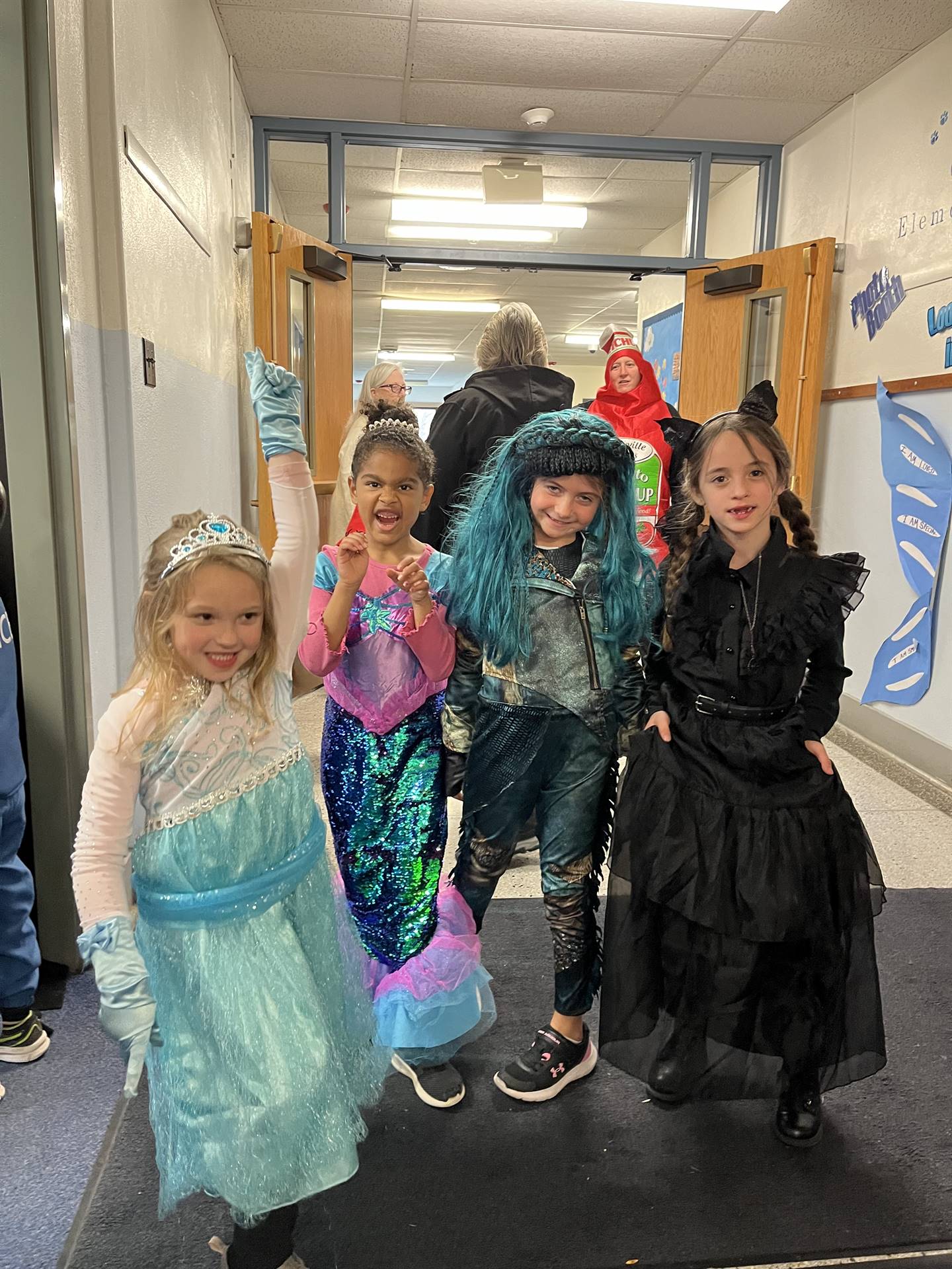 group of 4 students dressed up for Halloween