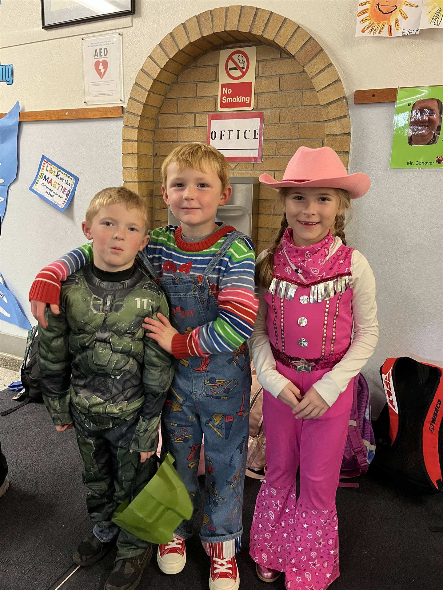 group of 3 students dressed up for Halloween
