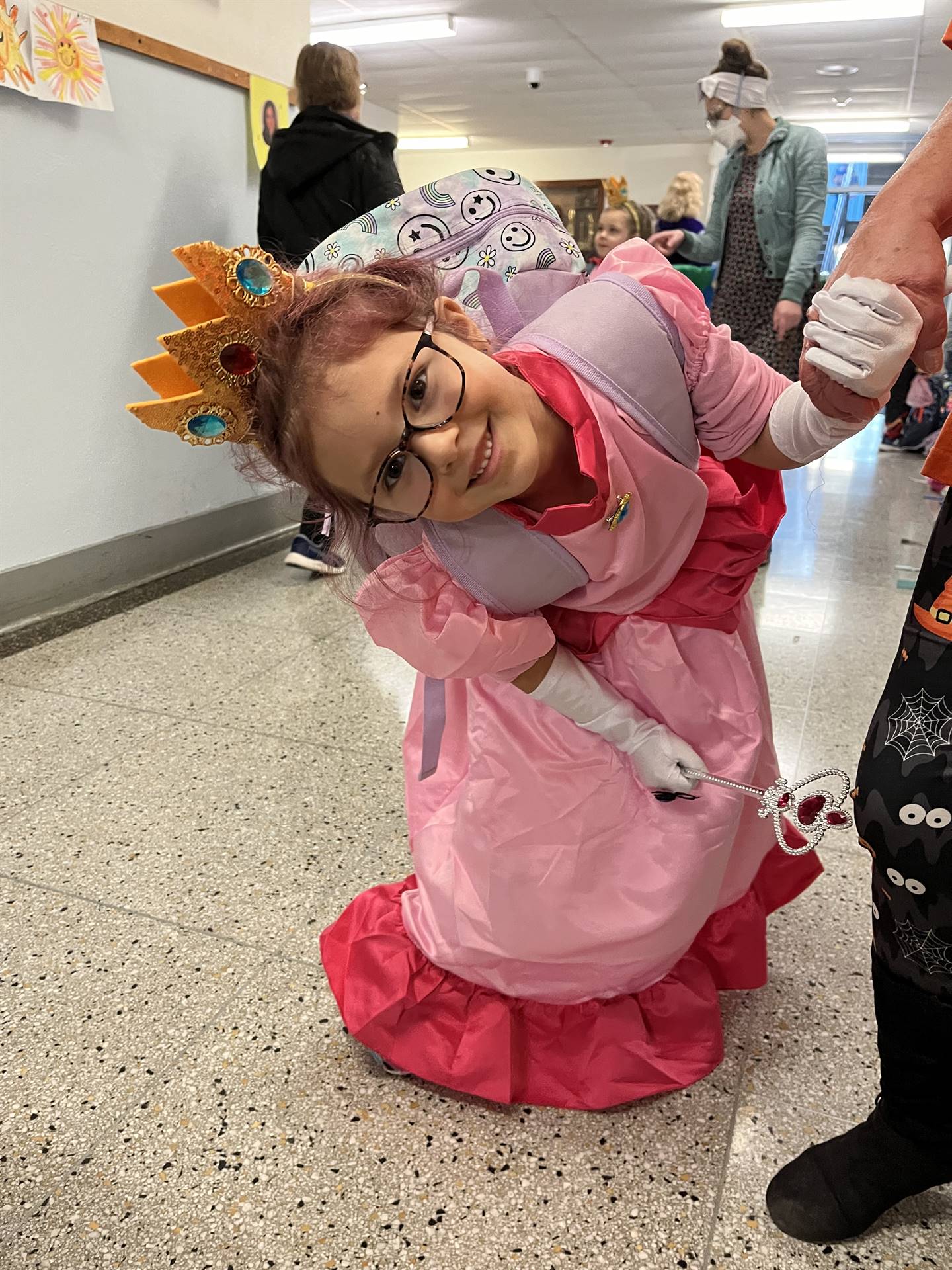 student dressed up as a princess and turned sideways.