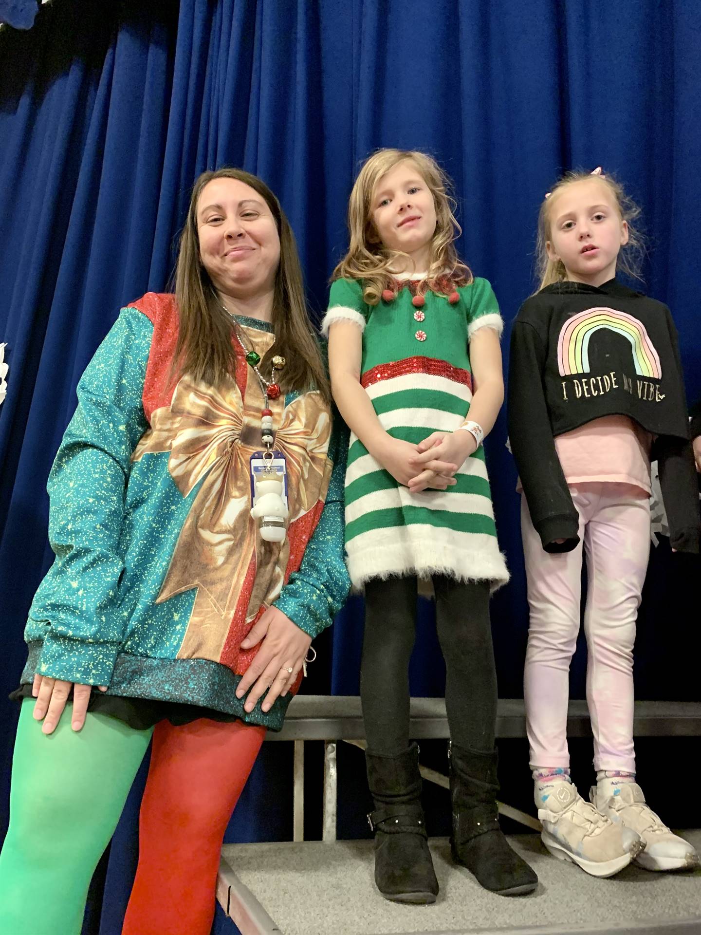 some students and a staff member dressed in holiday attire