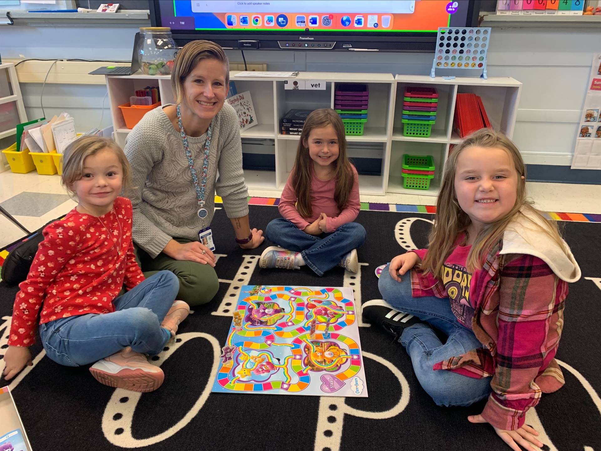 a teacher plays candy land with students