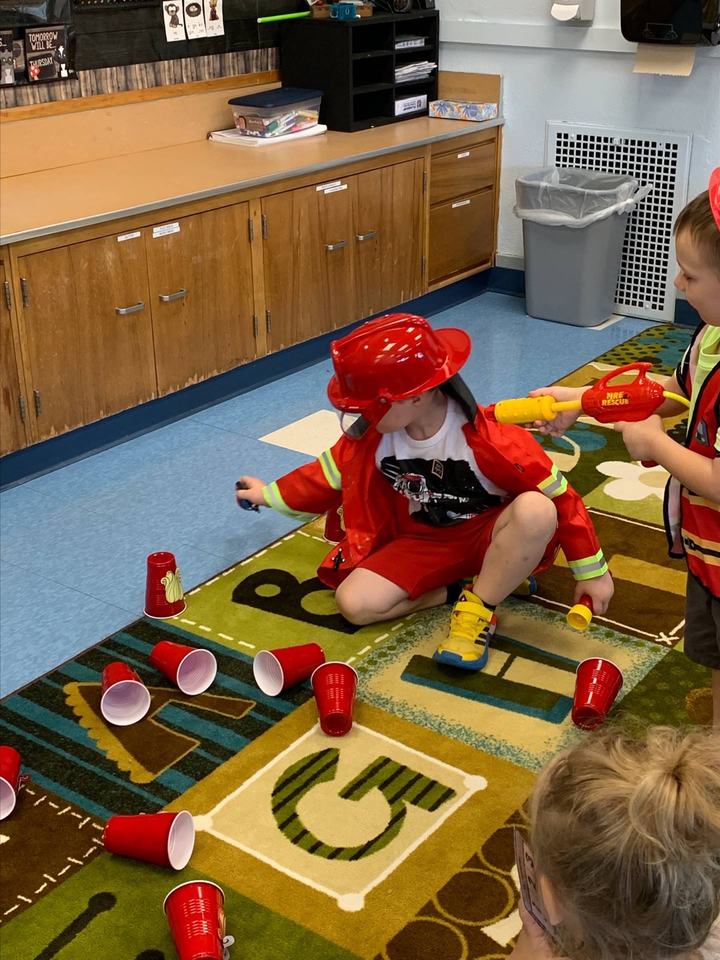 dressed up as a firefighter on the floor