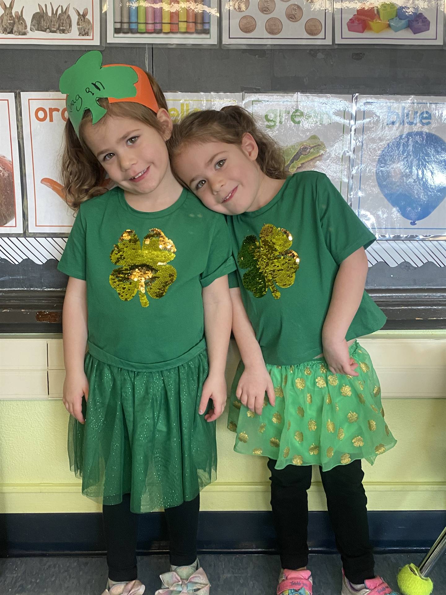 twins dressed in green attire!