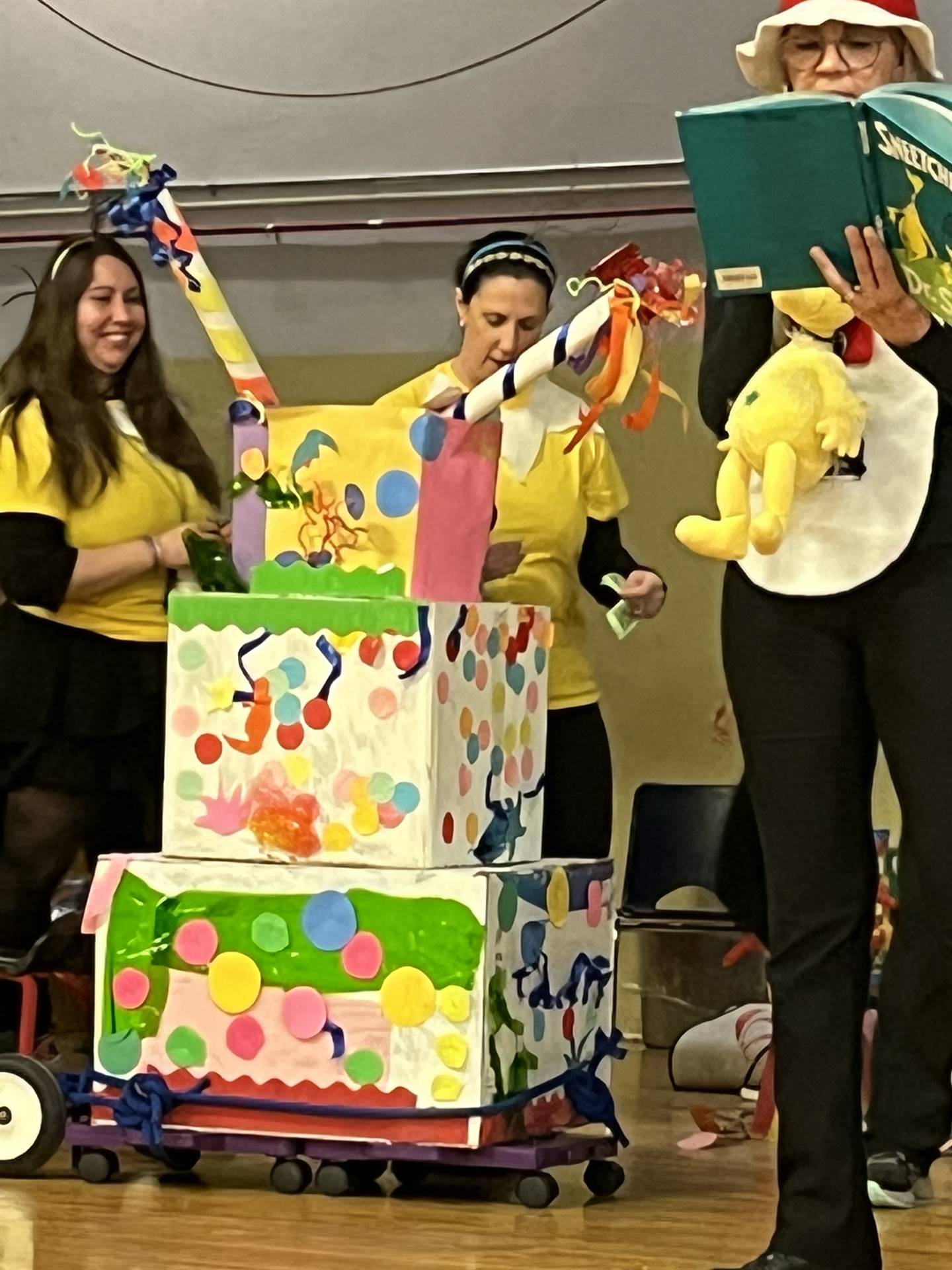 teachers get stars out of a brightly colored machine with cat in the hat