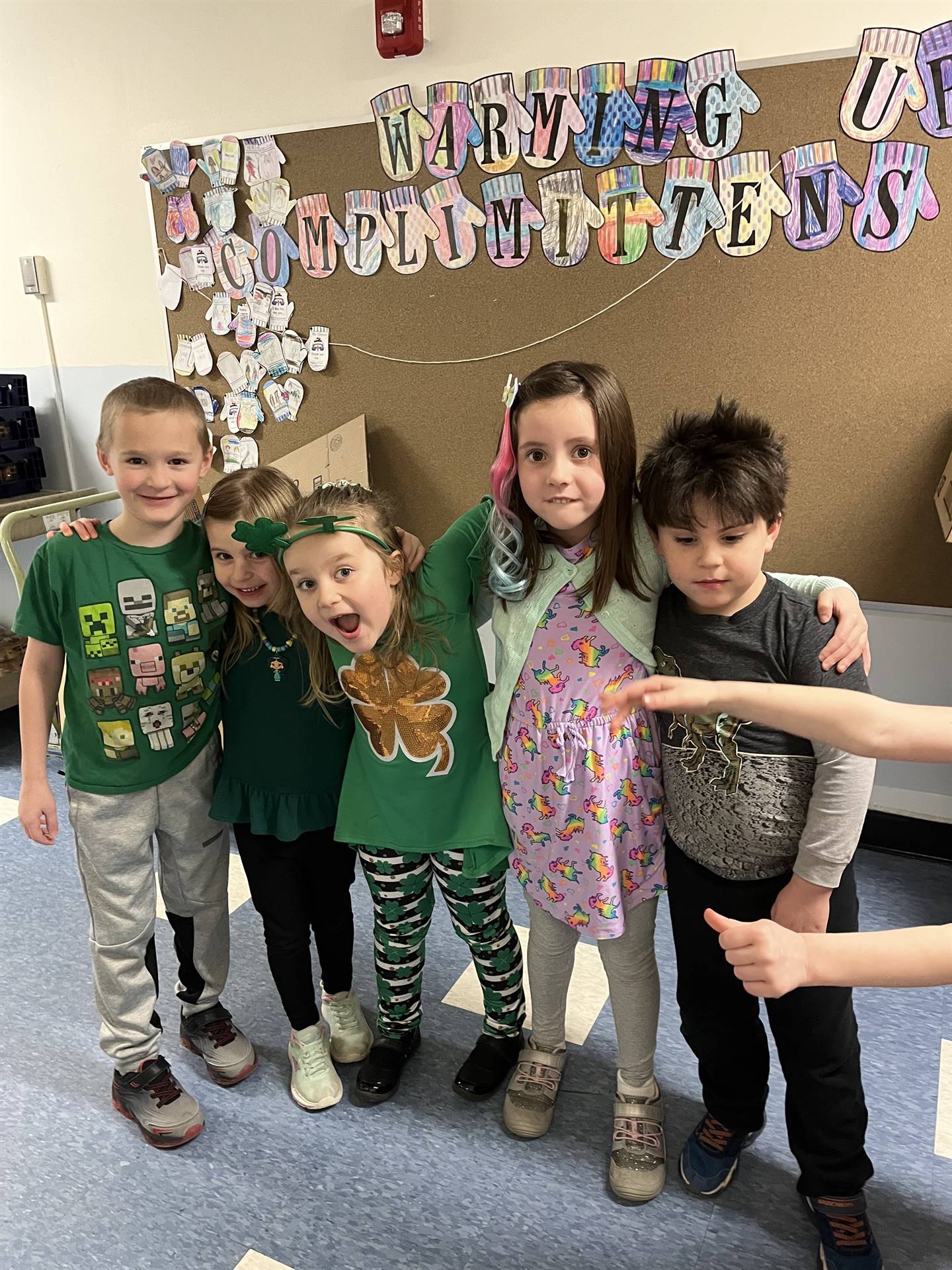 students in assorted dress including green shamrocks.