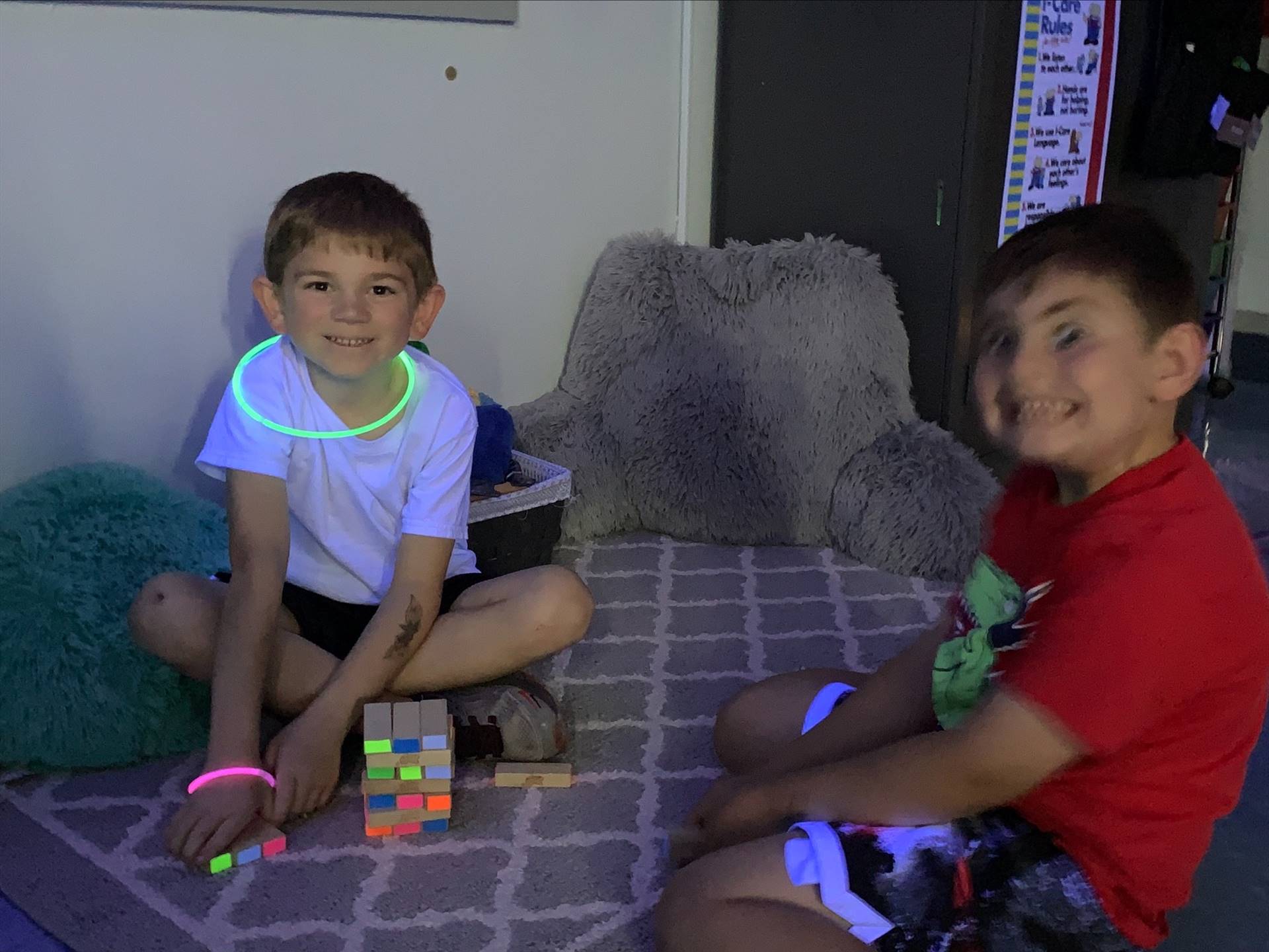 2 students with glow necklaces