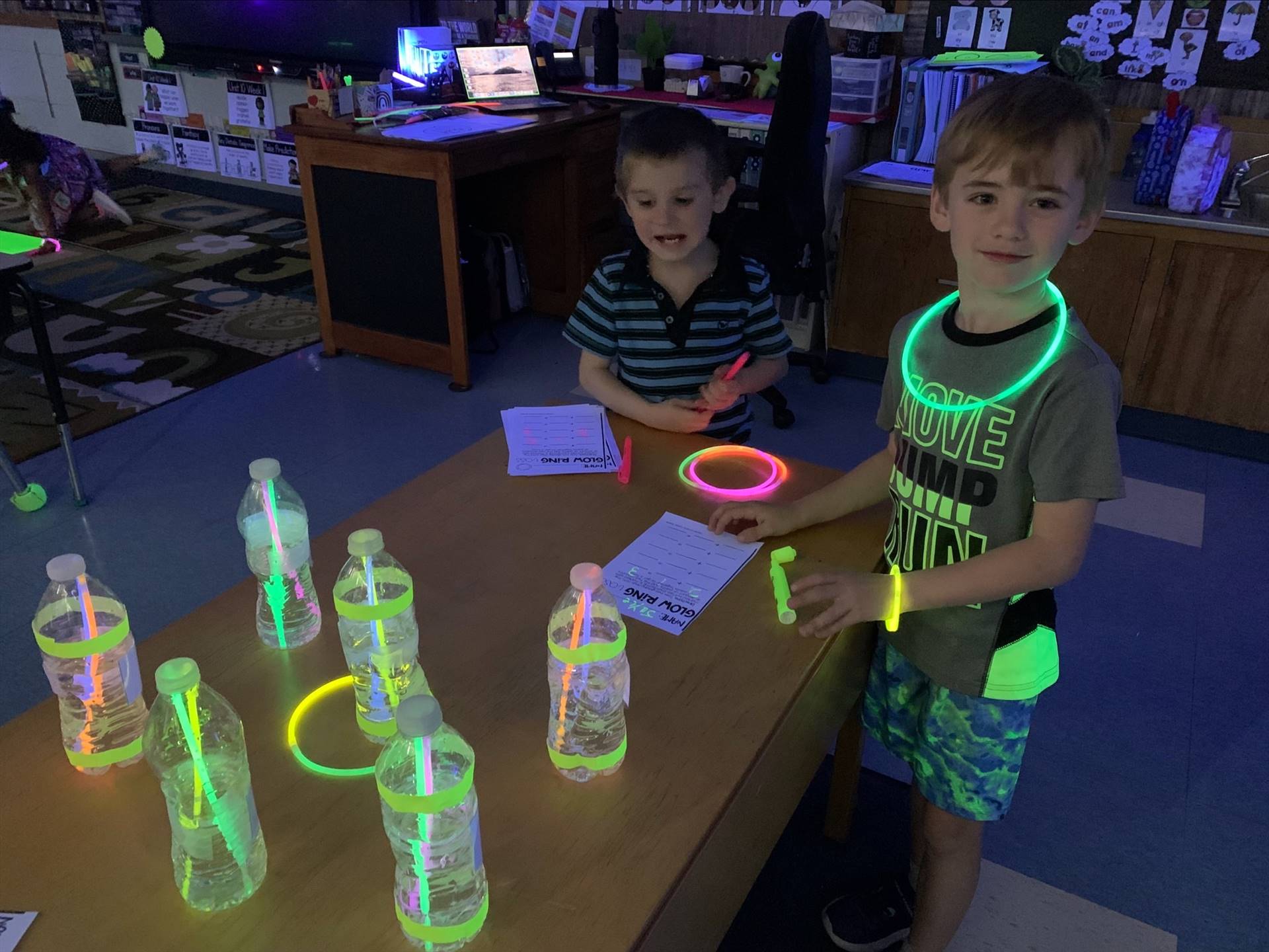 a student with glow glasses and necklace