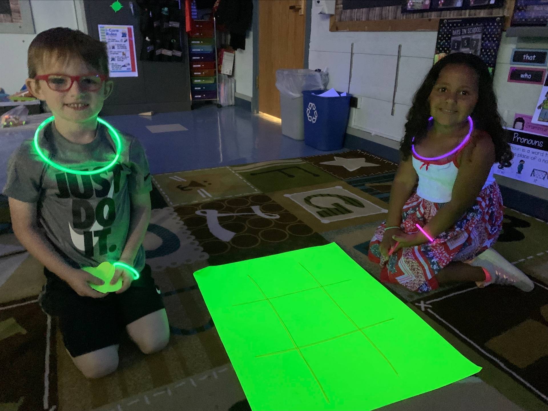 a student with glow glasses and necklace