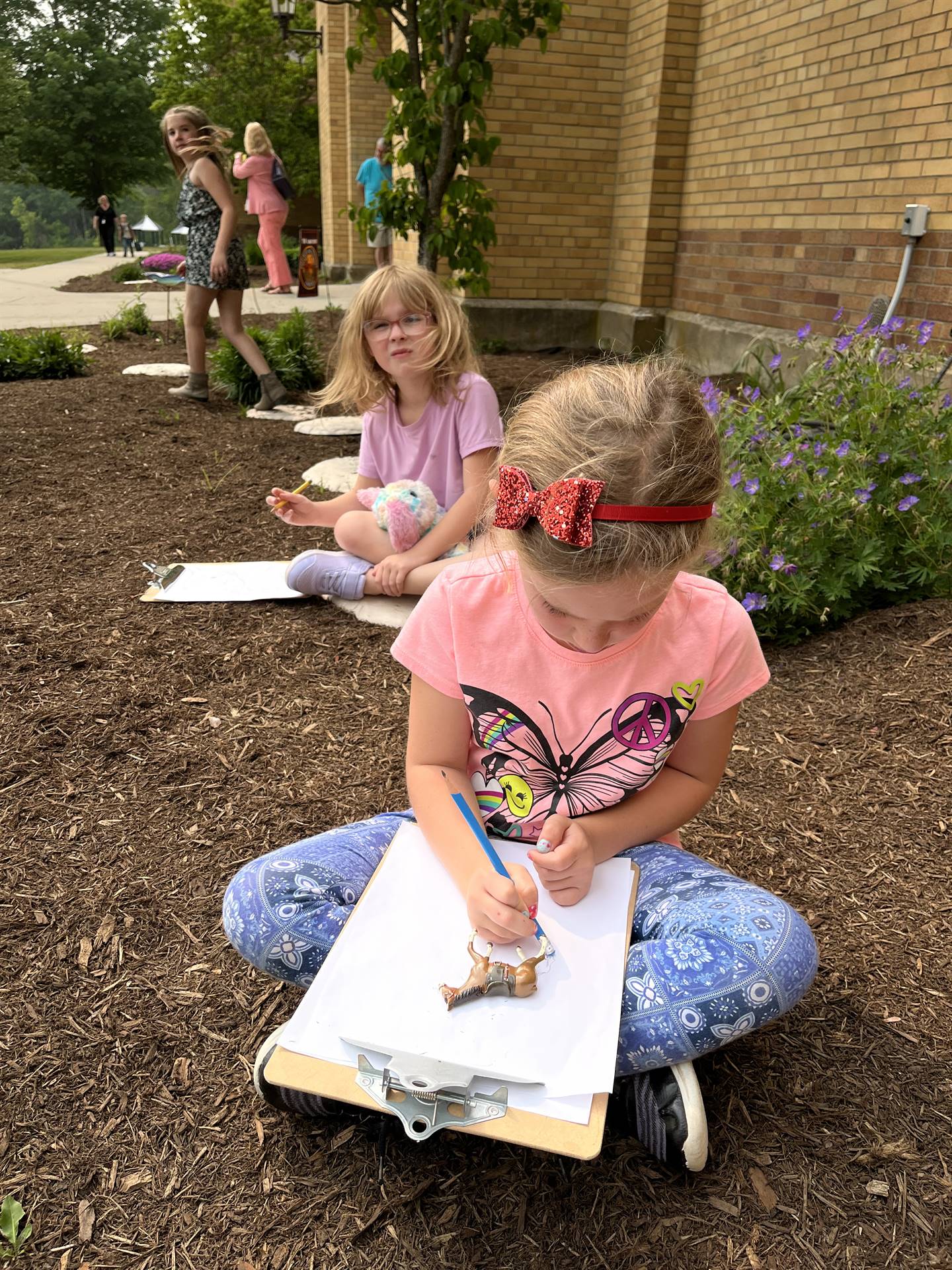 student in garden shadow drawing