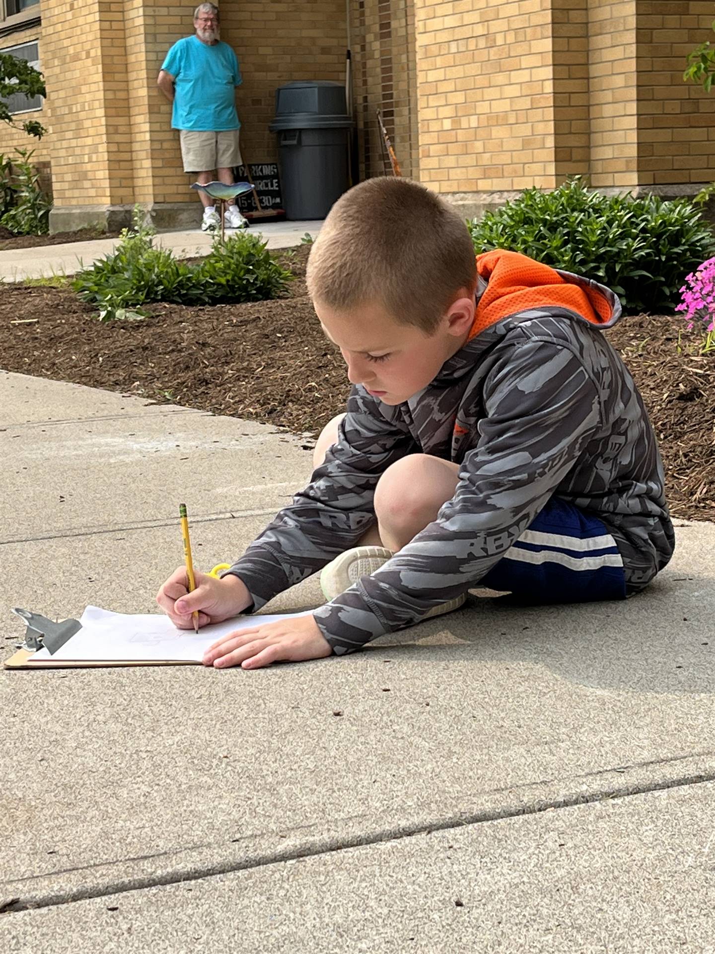 student in garden shadow drawing