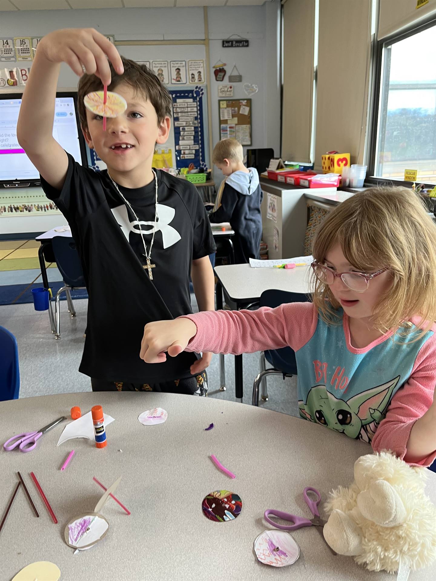 students trying out their homemade spinning tops