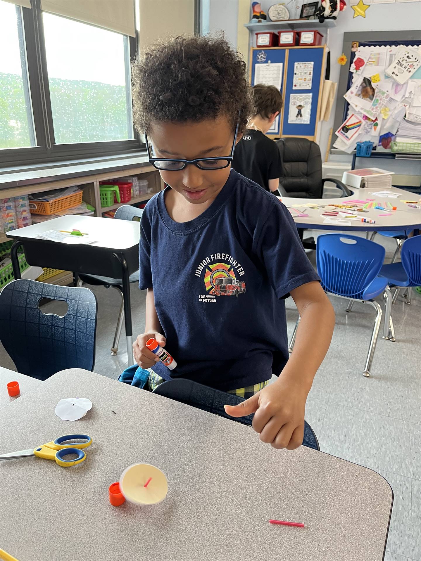 students trying out their homemade spinning tops