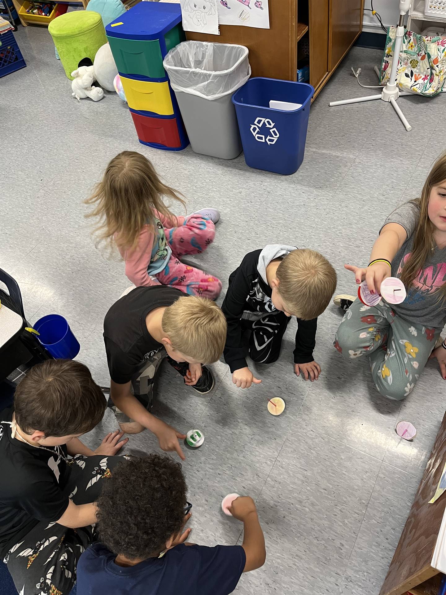 students trying out their homemade spinning tops