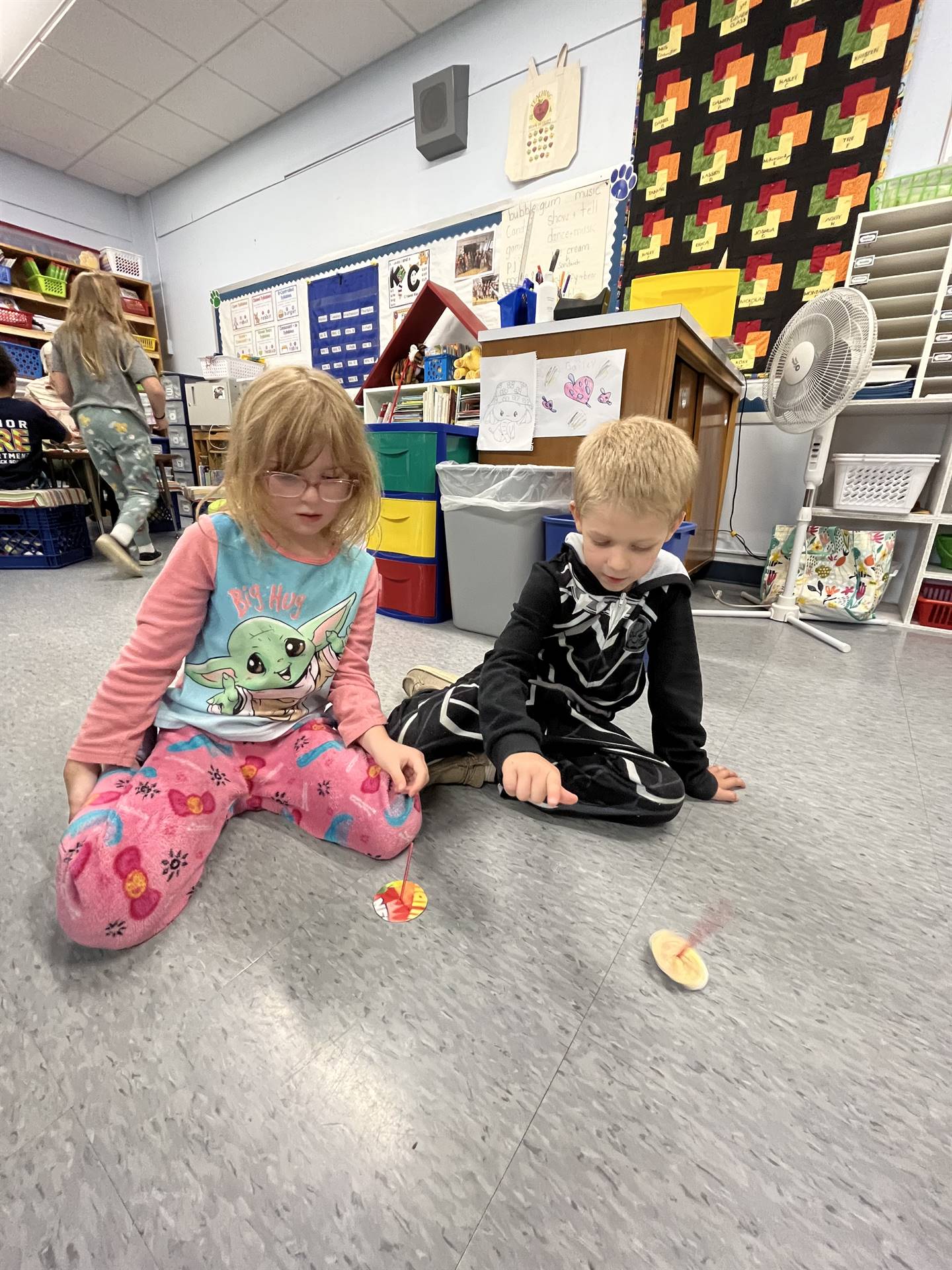 students trying out their homemade spinning tops