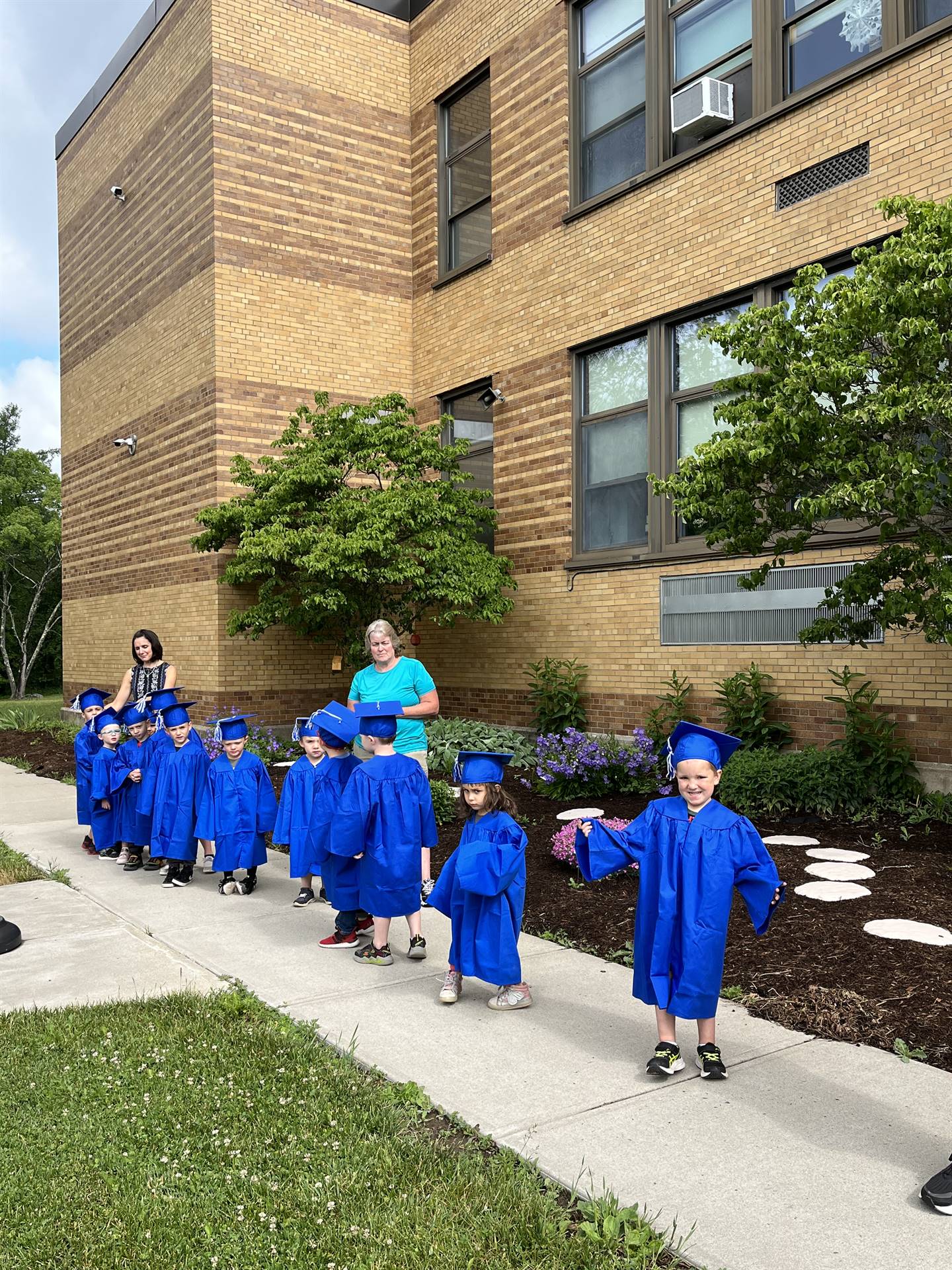 Pre K graduate students ready to greet senior graduates