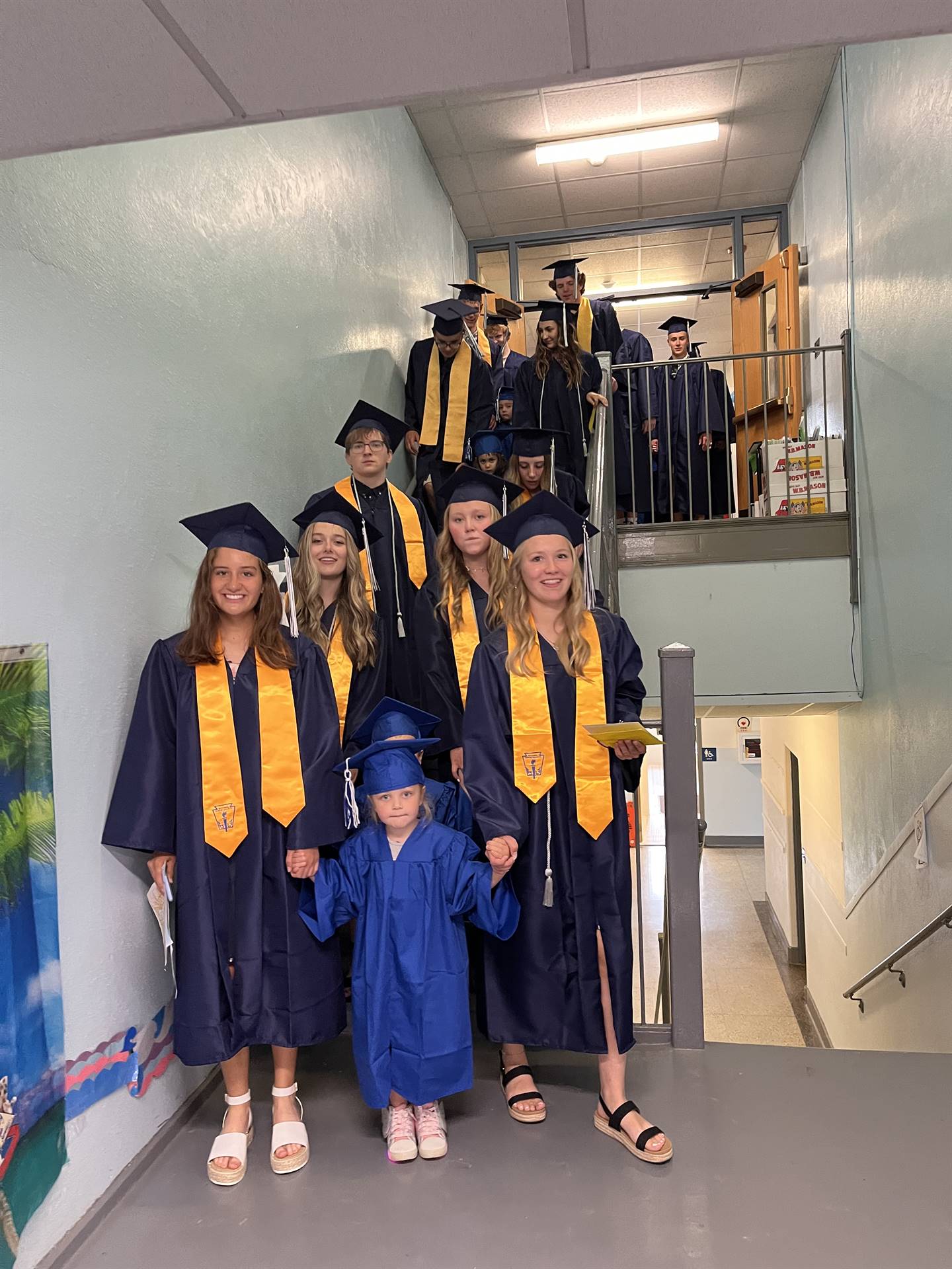 2023 Senior graduates in the hallway of their primary school