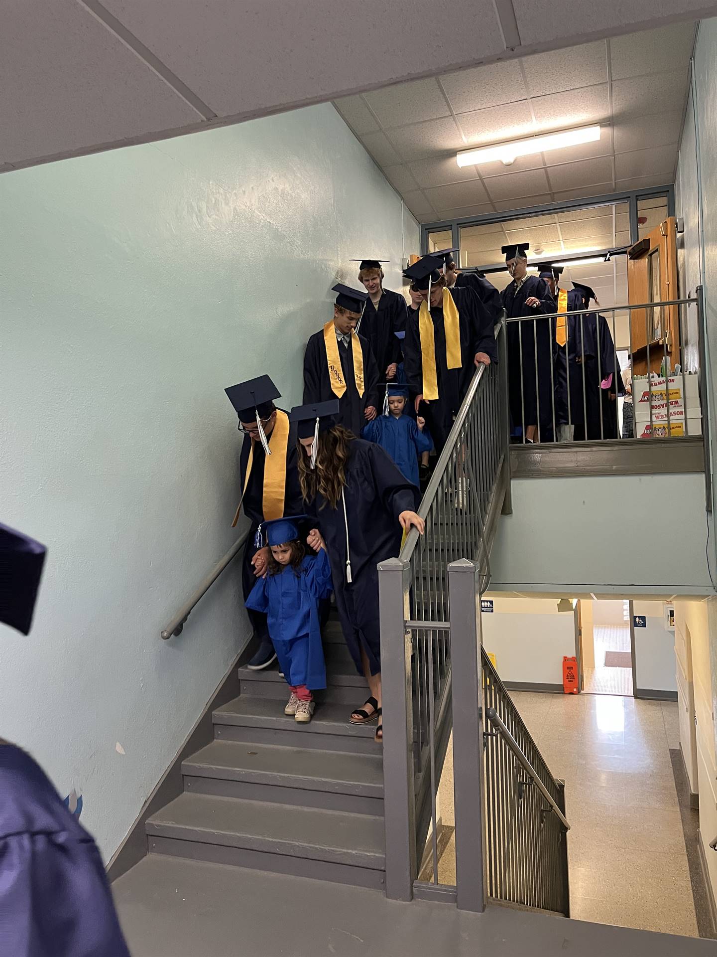 2023 Senior graduates in the hallway of their primary school